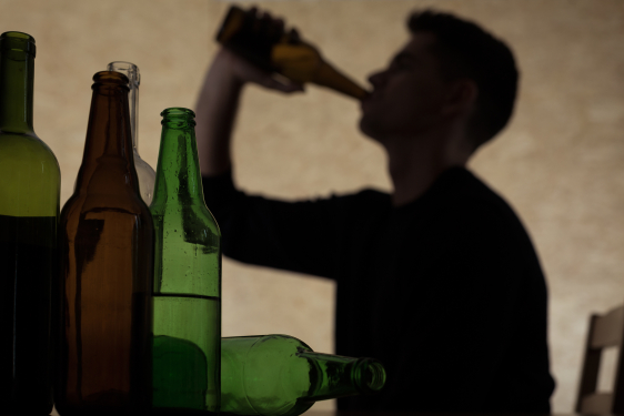 man drinking from bottle 