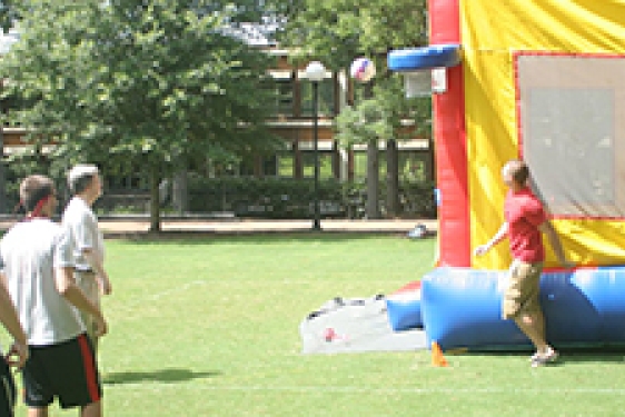 people with inflated bounce house