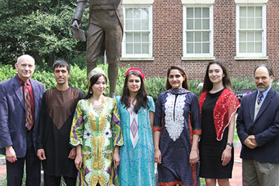 people outside with statue