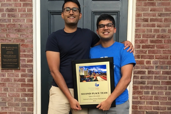 Pictured: Advait (left) and Swapnil with their 2nd place trophy.