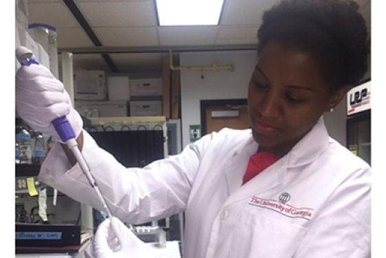 woman in lab with injector