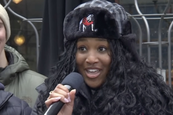 photo of woman with winter hat and microphone