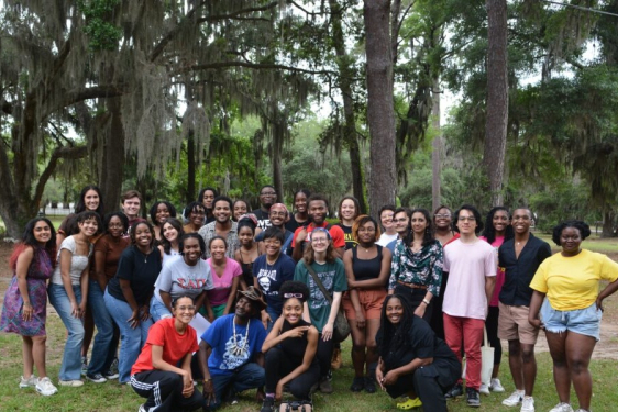 group photo under oaks and pines with Spanish moss