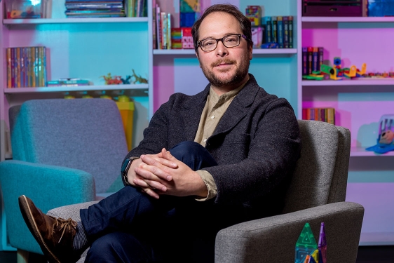 photo of man seated in office