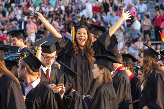 group of grads with women at center