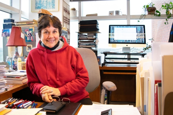 photo of woman in office, with windows, day