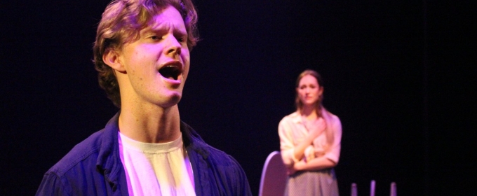 photo of three people, man in foreground singing