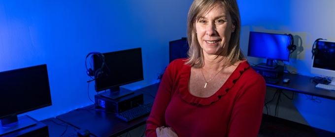 photo of woman, computer lab in background